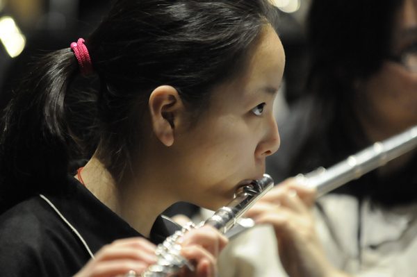 A flute player mid-phrase